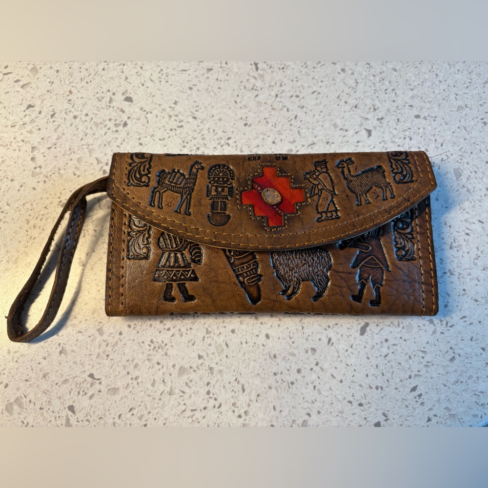 VTG Leather Peruvian Style Wallet with Embossed Figures and a Red Textile Centre